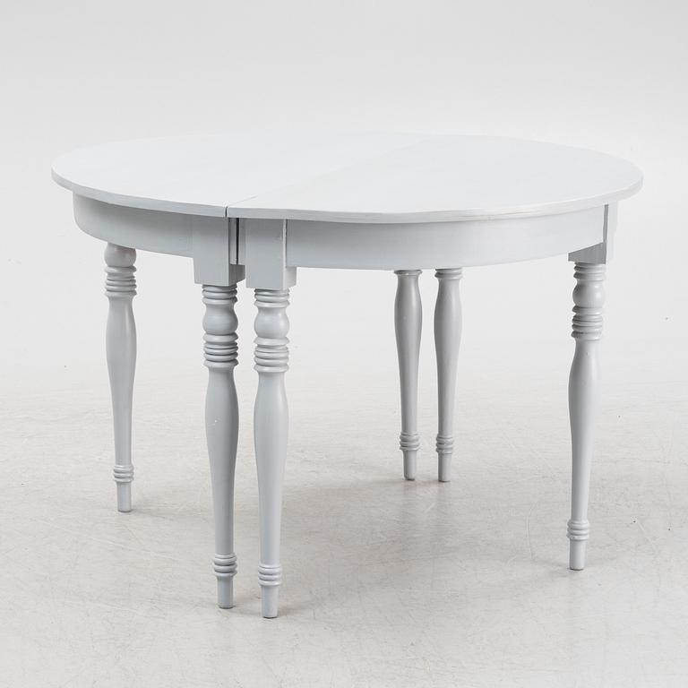 A late 19th century painted dining table.