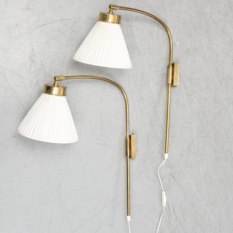 A pair of brass wall lamps, model 2484, designed by Josef FranK, Firma Svenskt Tenn.