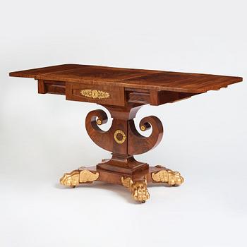 A Swedish Empire mahogany center table by Johan Öman, (Stockhom 1815-1833).