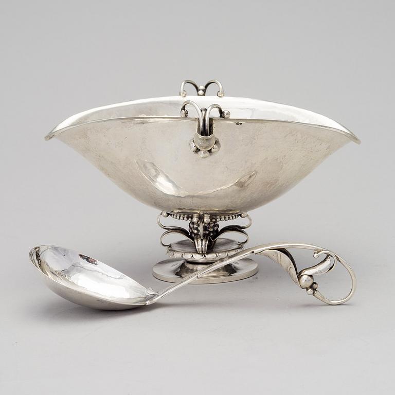 A silver sauce bowl with spoon, Copenhagen 1915-21. Design nr 233 and 141.