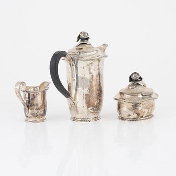 A Swedish silver coffee-pot, creamer and sugerbowl with lid, mark of CF Carlman, Stockholm 1947.