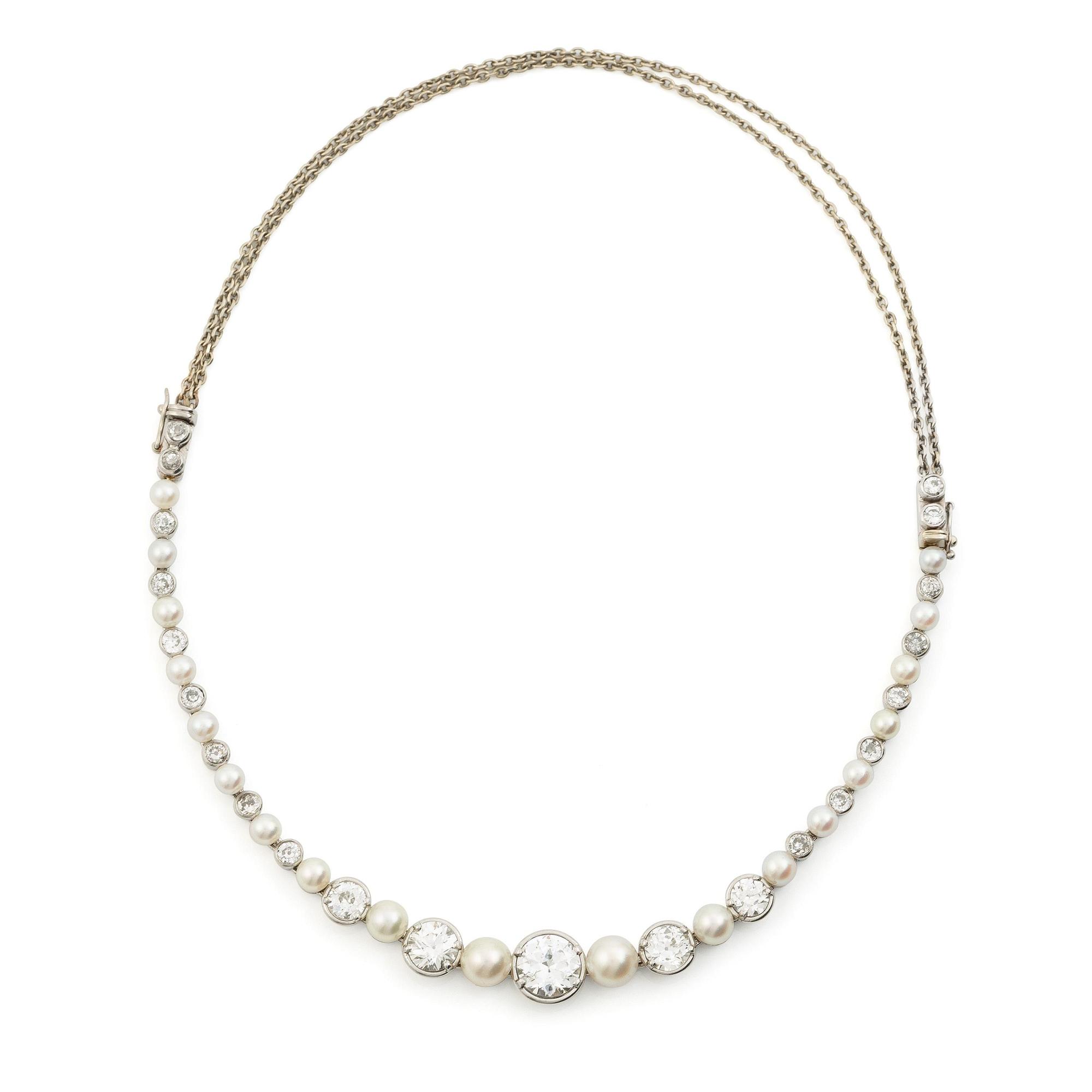 Bracelet/necklace platinum and 18K white gold with pearls and old-cut diamonds. Likely from the 1930s.