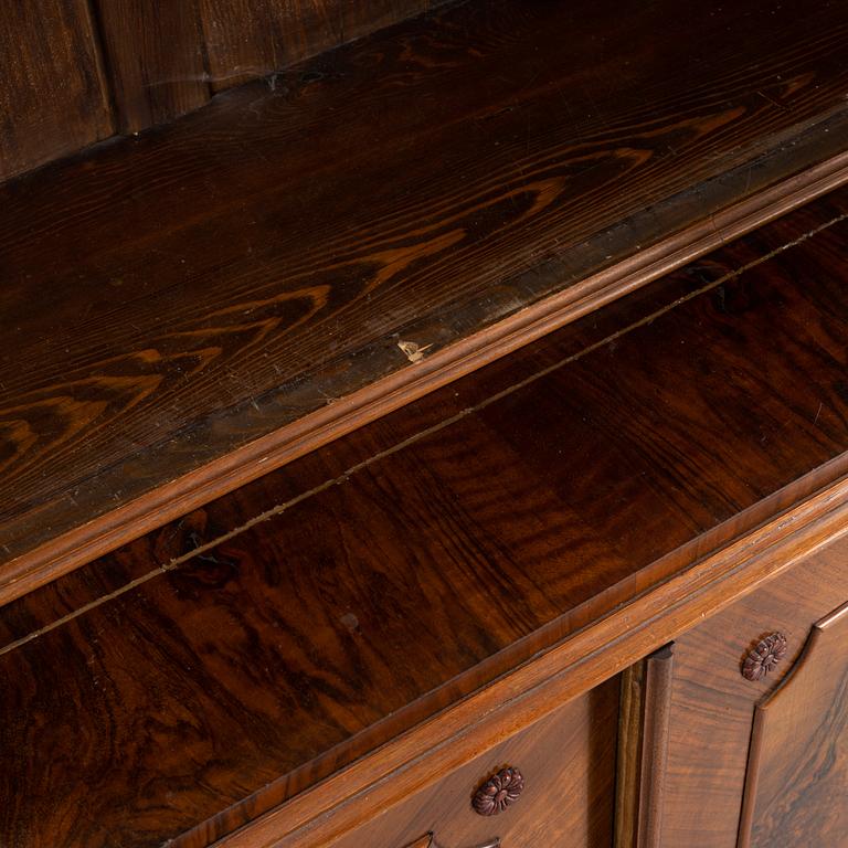 A walnut veneered book cabinet, second part of the 20th Century.