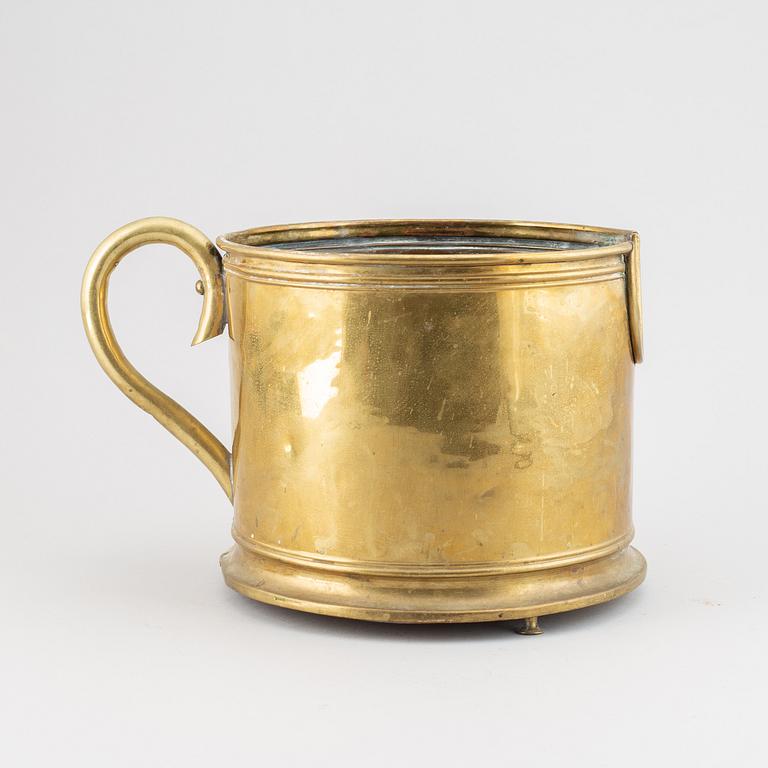 A 19th century brass champagne cooler.