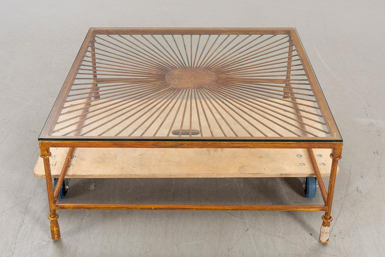 A late 20th century metall and glass coffee table.