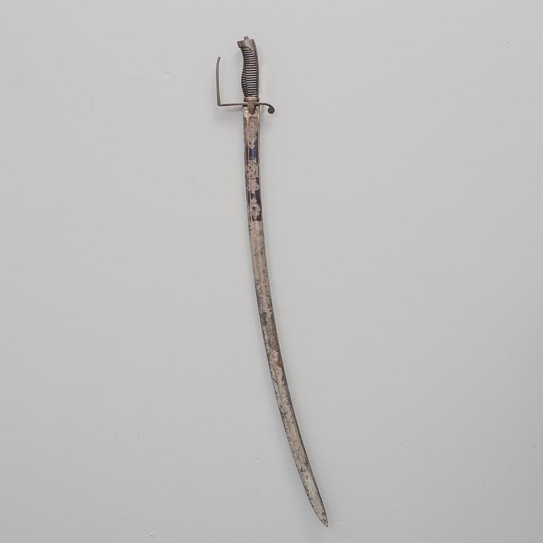 A british sabre with scabbard circa 1800.