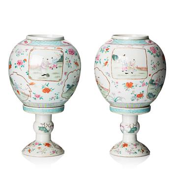 A pair of famille rose lanterns with stands, late Qing dynasty.