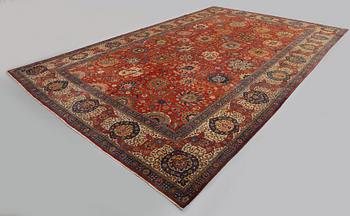 A carpet, a semi-antique Tabriz, ca 528-535 x 346,5-352,5 cm, signed Farhan.