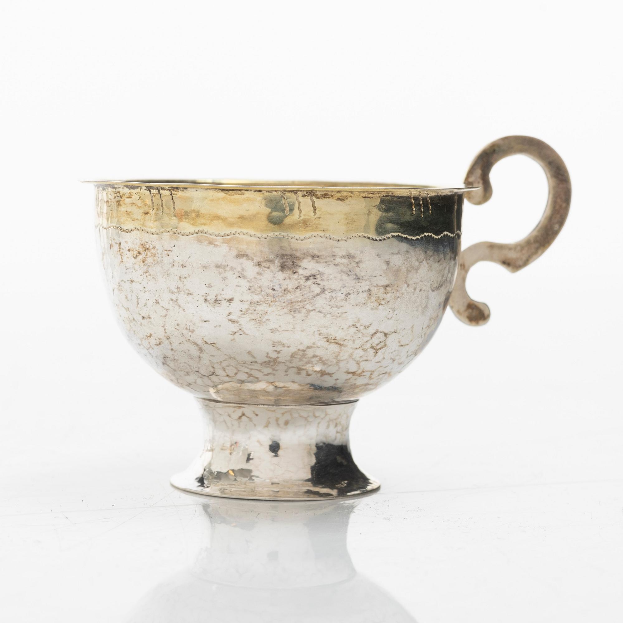 A set of eleven silver punch mugs, including with mark of Nya Guldsmedsaffären Göte Persson, Vilhelmina 1951.