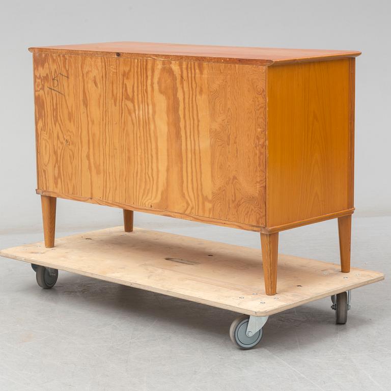 A 1940's elm Swedish Modern chest of drawers.