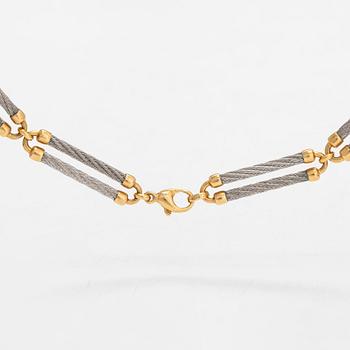 A 'Force 10' necklace, 18K gold and steel. Fred, Paris 1980's.