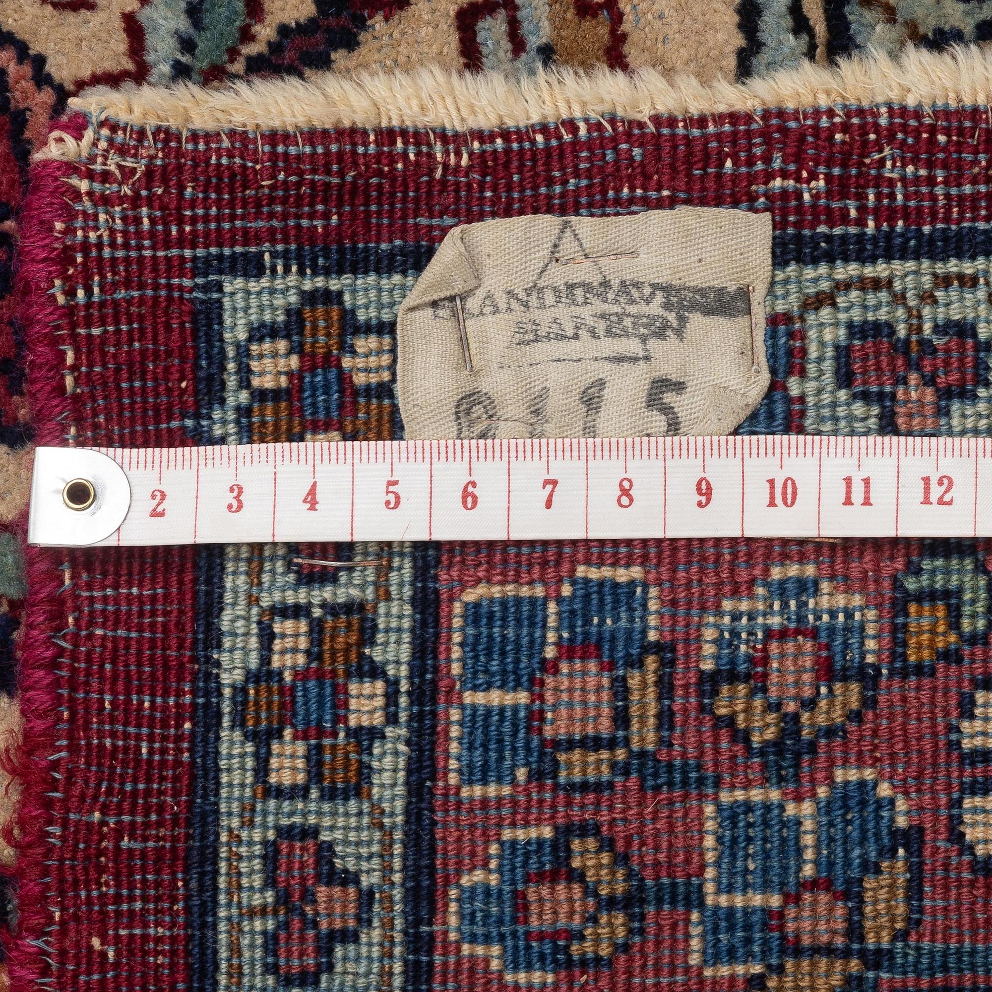 An antique 'Millefleur' Kerman Laver carpet, c. 964 x 426 cm.