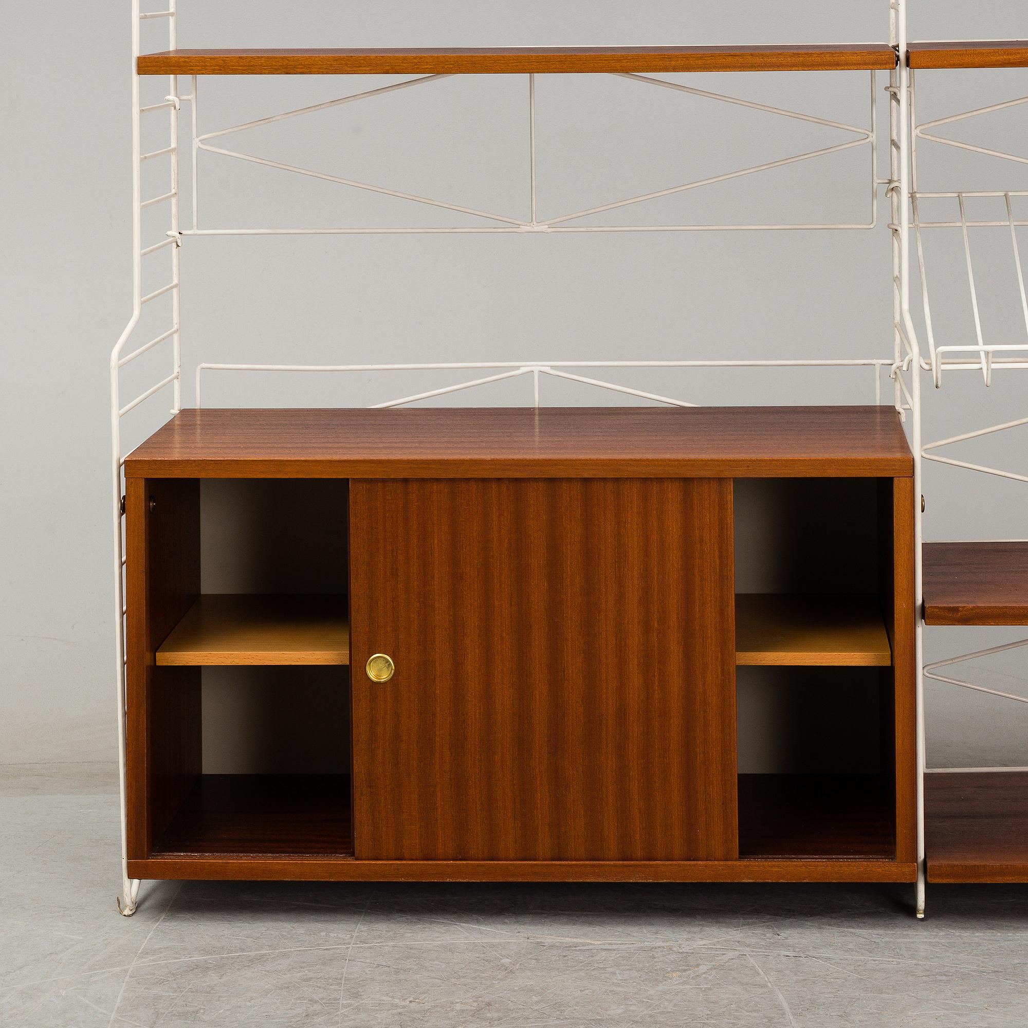 A 'String" bookcase, designed by  Nils Strinning,