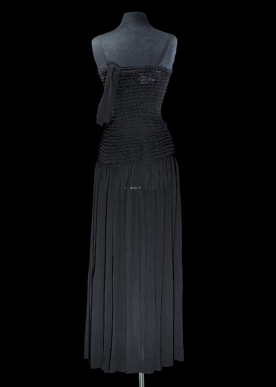 A black silk long dress by Yves Saint Laurent.