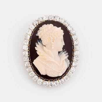 A hardstone cameo brooch with a frame of old cut-dimonds.