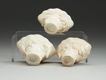 A set of three blanc de chine libation cups, Qing dynasty.