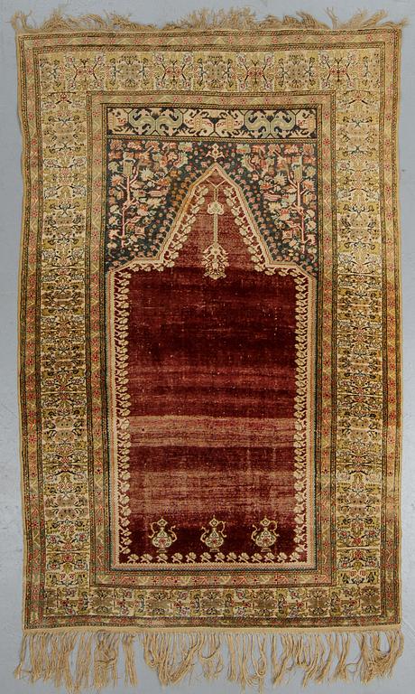 A rug, an antique Anatolia, probably Gördes (Ghiordes), a prayer rug, ca ca 188 x 124 cm.