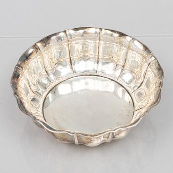 A set of eleven silver cups with saucers and a bowl, Germany, 20th Century.