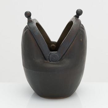 Outi Leinonen, a ceramic vase formed as a purse for Pentik, Finland.