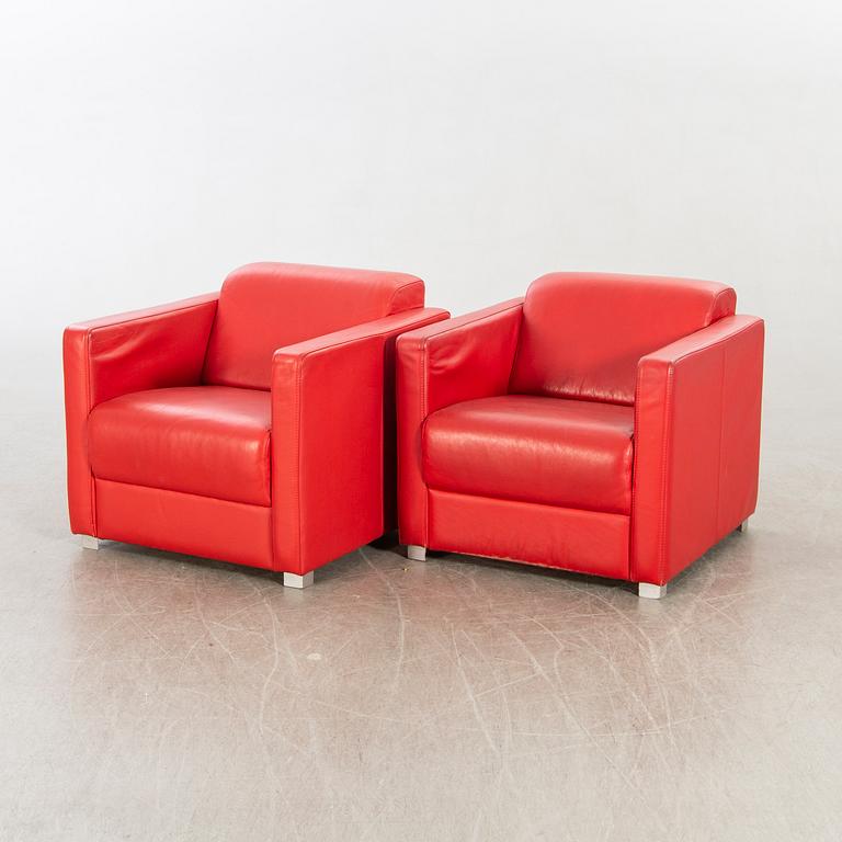 A pair of Italian 1990's leather armchairs.