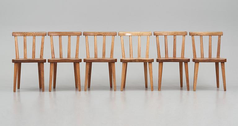 Axel Einar Hjorth, a set of six "Utö" stained pine chairs, Nordiska Kompaniet 1930s.