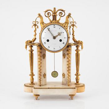 A Louis XVI marble and ormolu portico clock, the dial signed Bouchet, late 18th century.