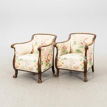 A pair of stained birch 1940s armchairs.