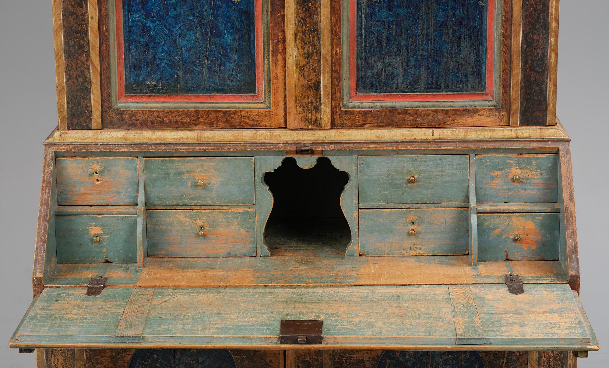 A polychrome-painted folk art cabinet from Värmland, Sweden, dated 1818.