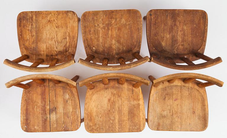 Axel Einar Hjorth, a set of seven stained pine "Utö" chairs, Nordiska Kompaniet, Sweden, 1930s.