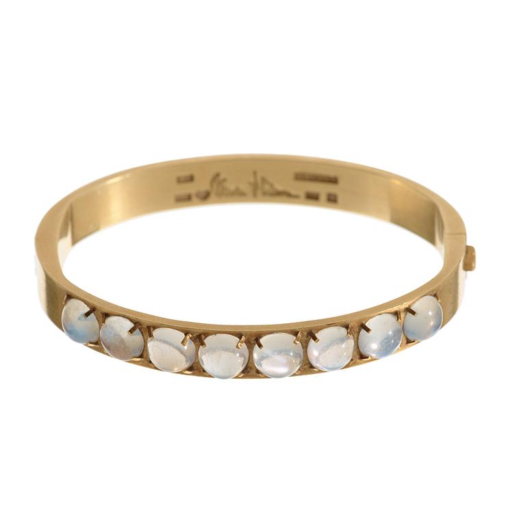 A Wiwen Nilsson 18k gold bangle with eight cabochon cut moonstones, Lund 1947.