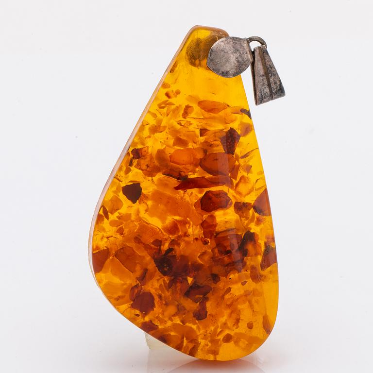 Amber set in silver, pendant, ring and earrings.