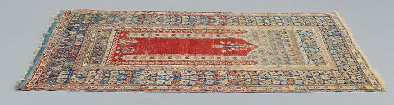 A RUG, an antique Anatolia, probably Gördes, a prayer rug, ca 177 x 124,5 cm (as well as flat weave at the ends 3 and 1.