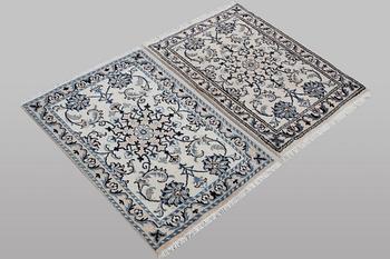 A pair of rugs, Nain, part silk, ca 80 x 60 cm 
 & ca 83 x 58 cm.