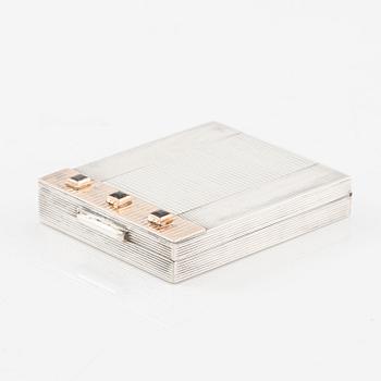 Powder box, signed Cartier, sterling silver and 14K gold with three sapphires.