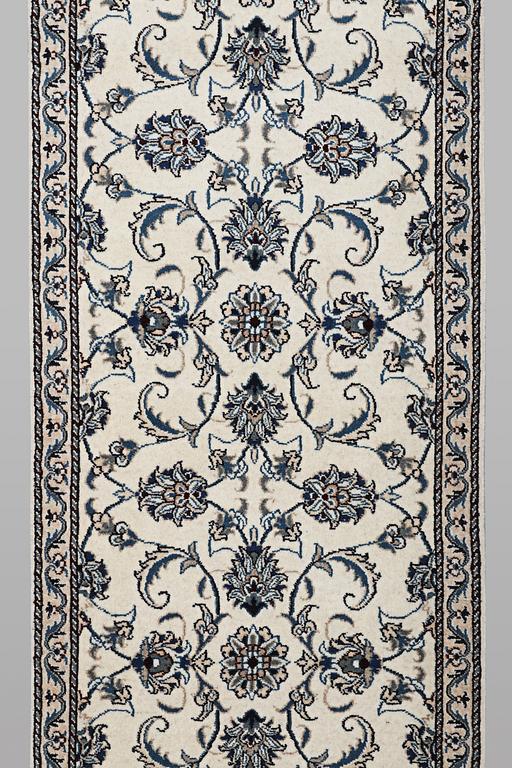 A runner carpet, Nain, part silk, ca 248 x 72 cm.