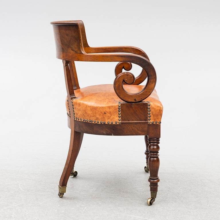An Empire armchair, 19th century.