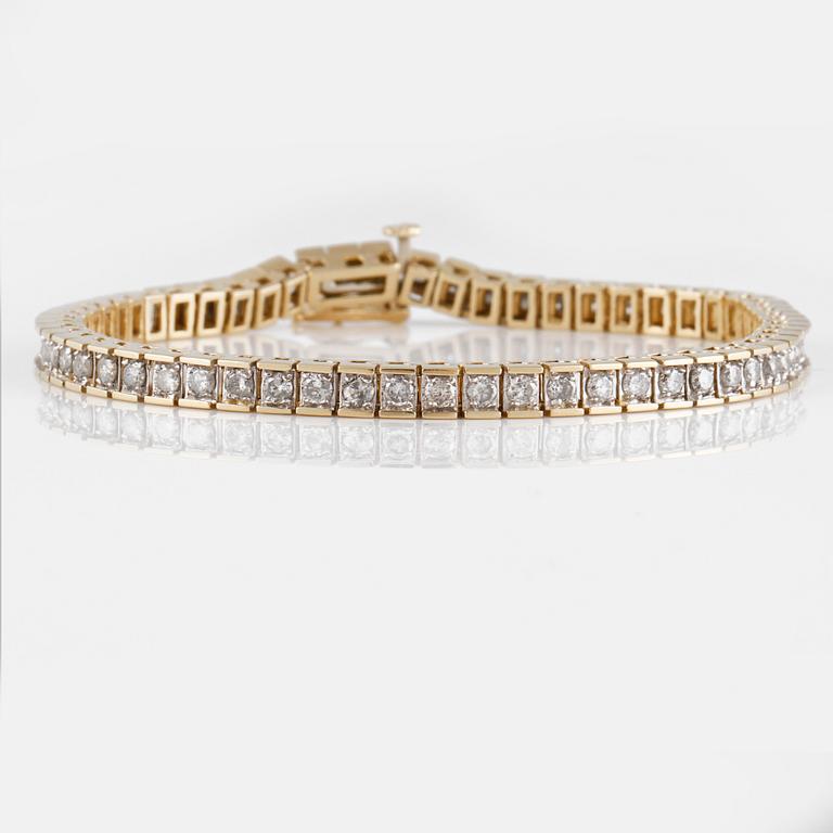 ARMLÄNK, 14K guld med briljantslipade diamanter ca 3.00 ct. Vikt 14,7 gram.