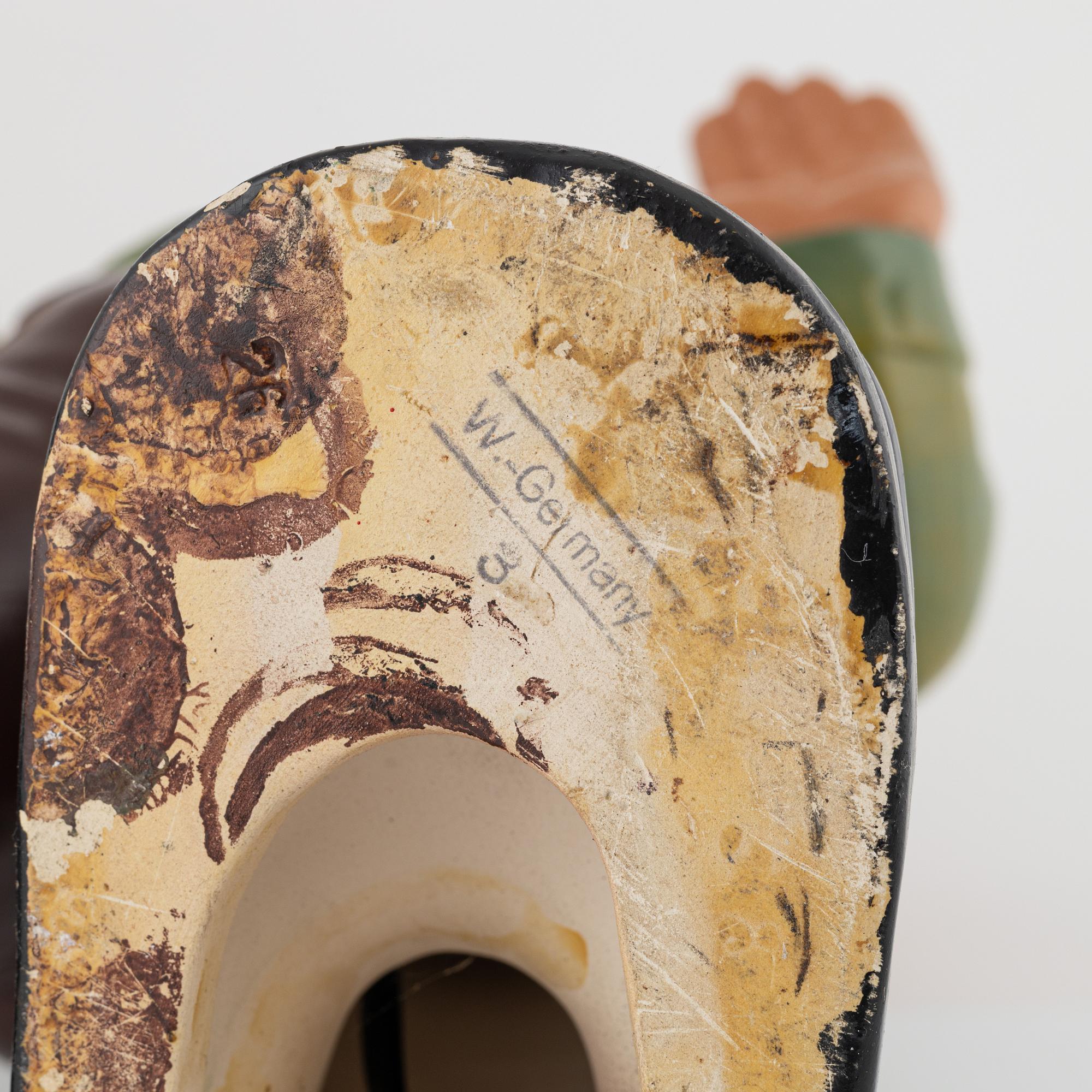 A West German earthenware gnome figurine with lantern from the second half of the 20th century.