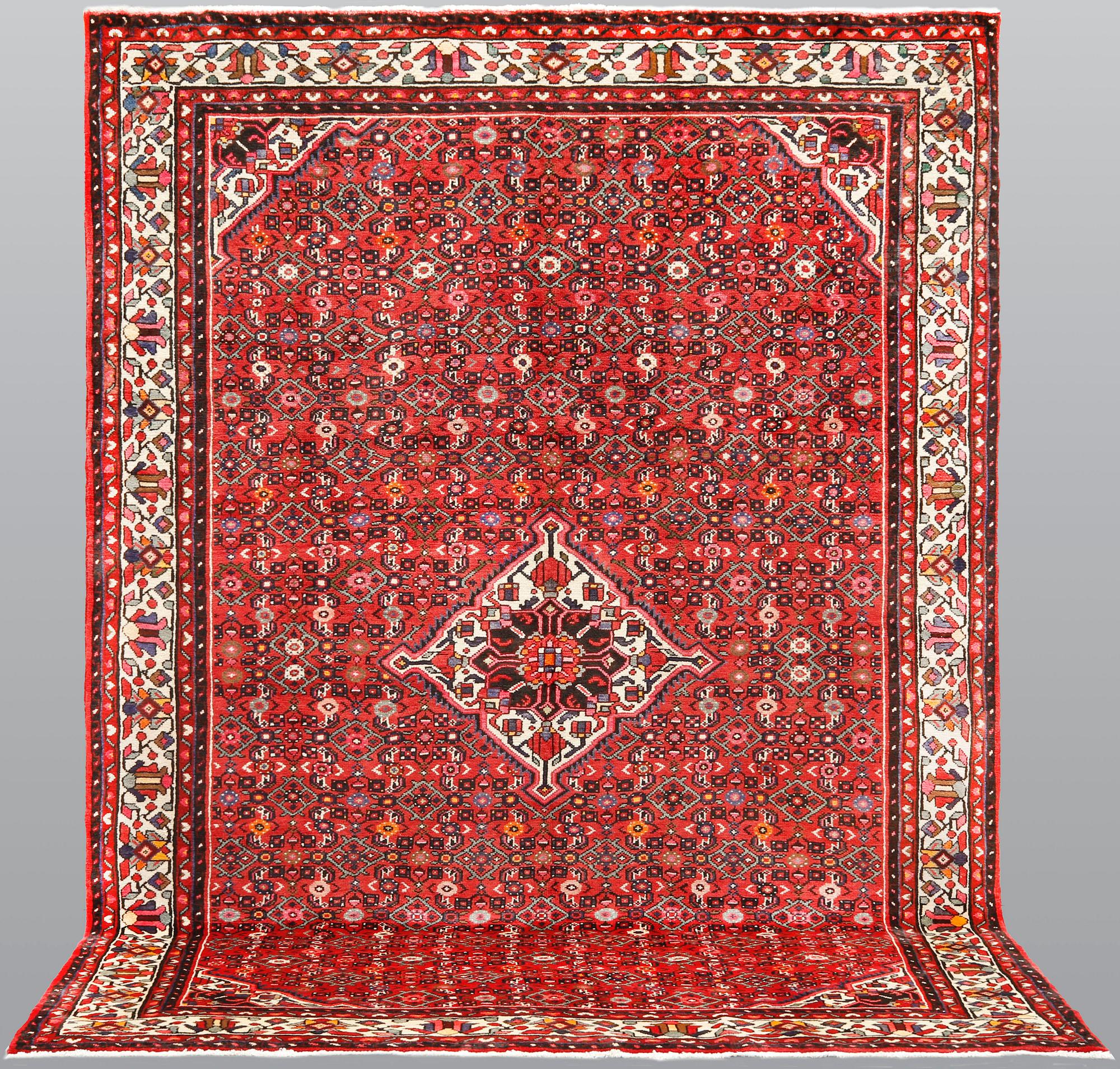 A Hosseinabad carpet, c 301 x 215 cm.