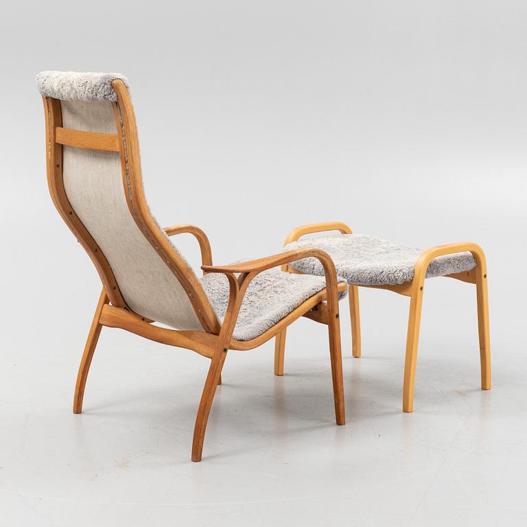 An Yngve Ekström Lamino sheepskin armchair and stool from Swedese.