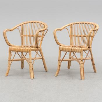 A pair of second half of the 20th century rattan easy chairs.