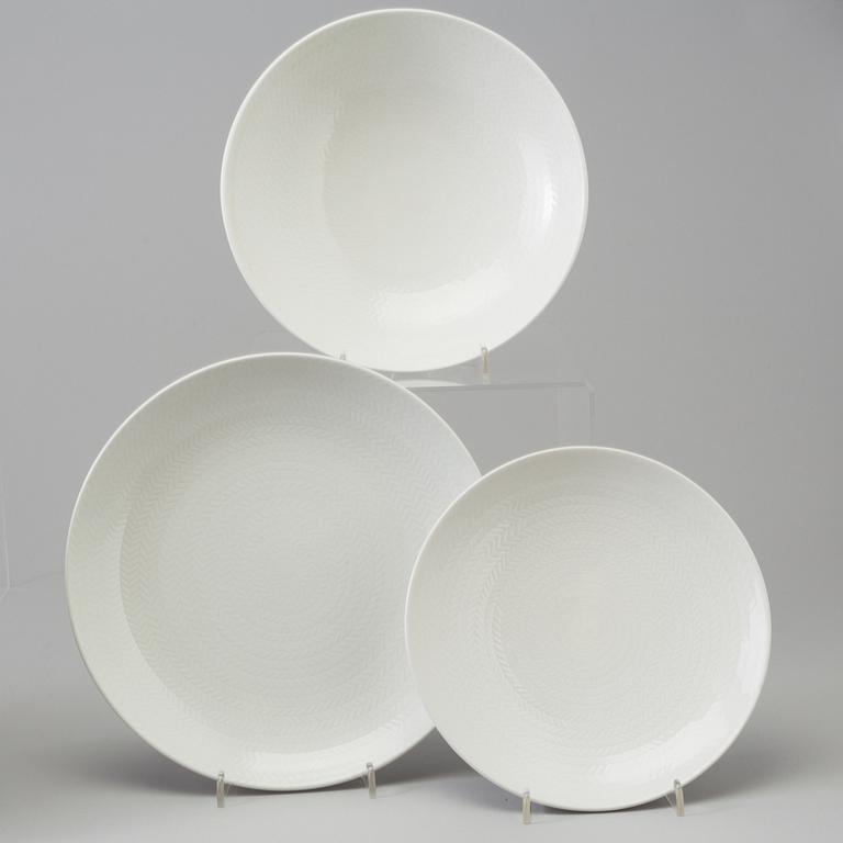 A Hertha Bengtsson 34 pcs 'Blå Eld' creamware dinner service, Rörstrand, second half of the 20th century.