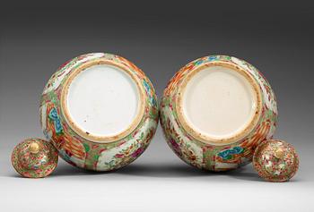 A pair of famille rose Canton vases with covers, Qing dynasty, 19th Century.