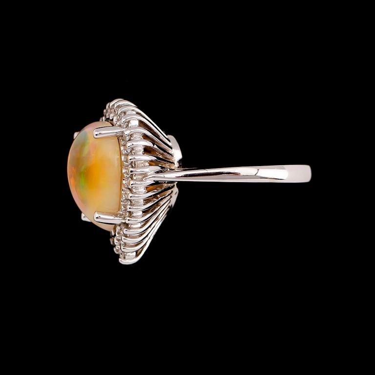 RING, 14 k guld, opal ca 2.90 ct, diamanter tot ca 0.35 ct.