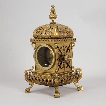 A brass mantle clock, early 20th century.