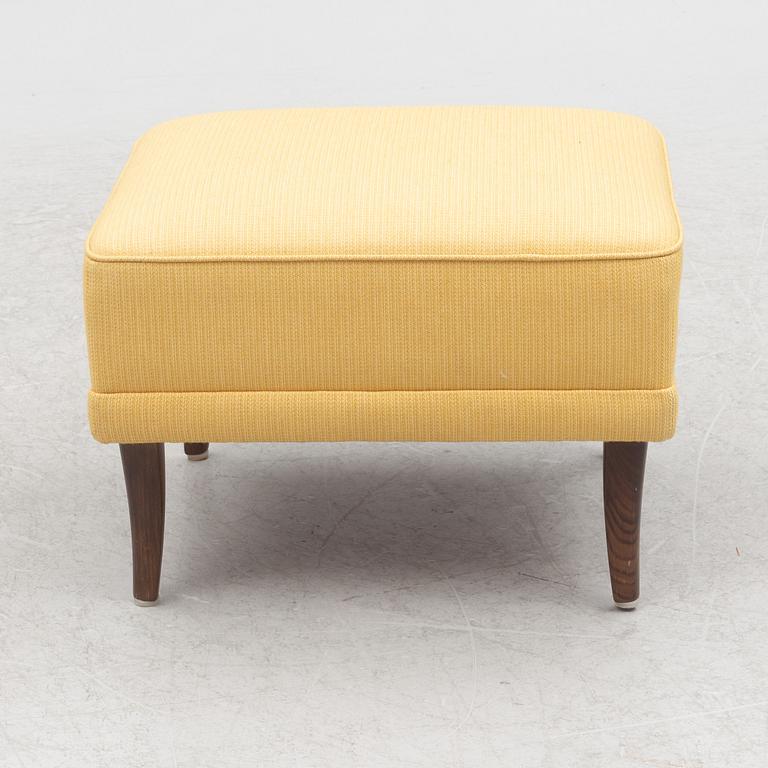 Carl Malmsten, a 'Hemmakväll' armchair and a 'Farmor' ottoman.