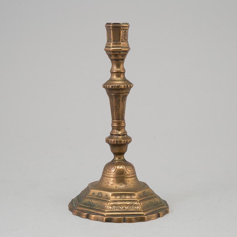 A 18th century bronze candlestick.