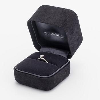 Tiffany & Co, A platinum ring with a ca. 0.26 ct diamond.