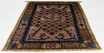 A Chinese silk and metal thread yellow ground 'five clawed dragon' carpet, Qing dynasty, 19th century. (Measure 208x126).