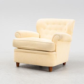 Josef Frank, a model 568 armchair by  Firma Svenskt Tenn.